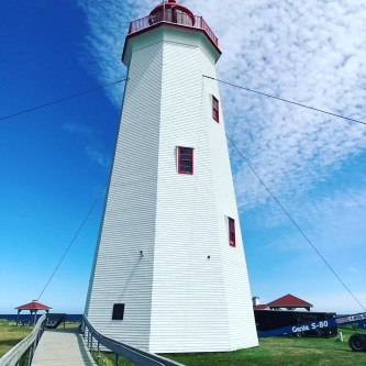 Miscue Island lighthouse on the northeastern tip of New Brunswick, Canada